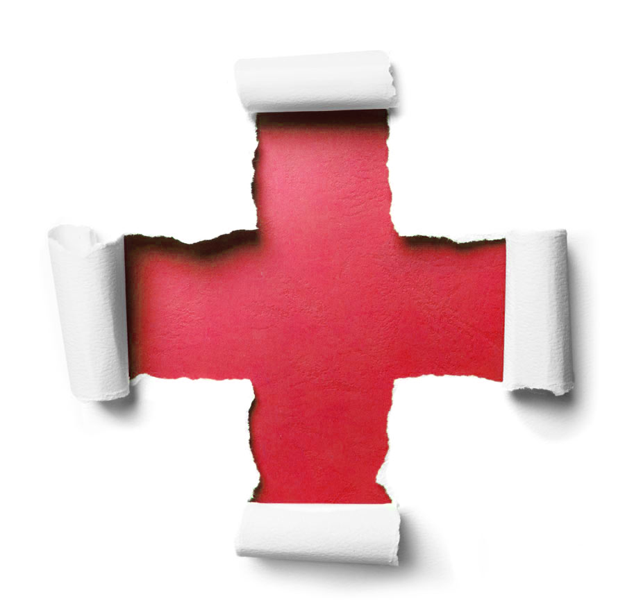 white paper torn in the shape of a medical cross