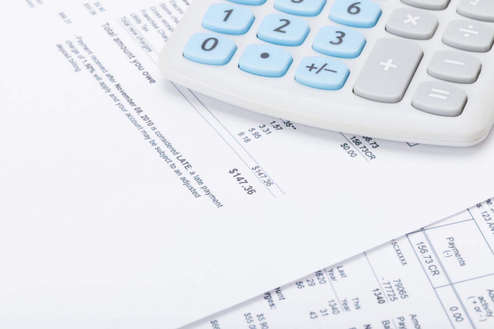 Calculator atop of paper financial statement