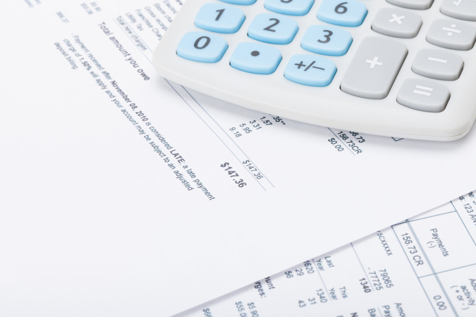 Calculator atop of paper financial statement