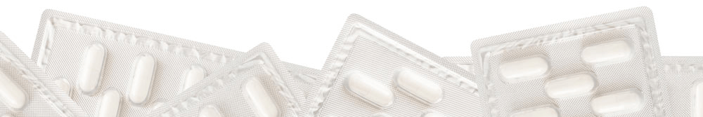 White pills in plastic packaging