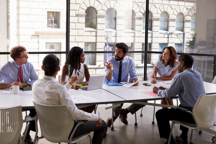 Young professionals at a conference room table
