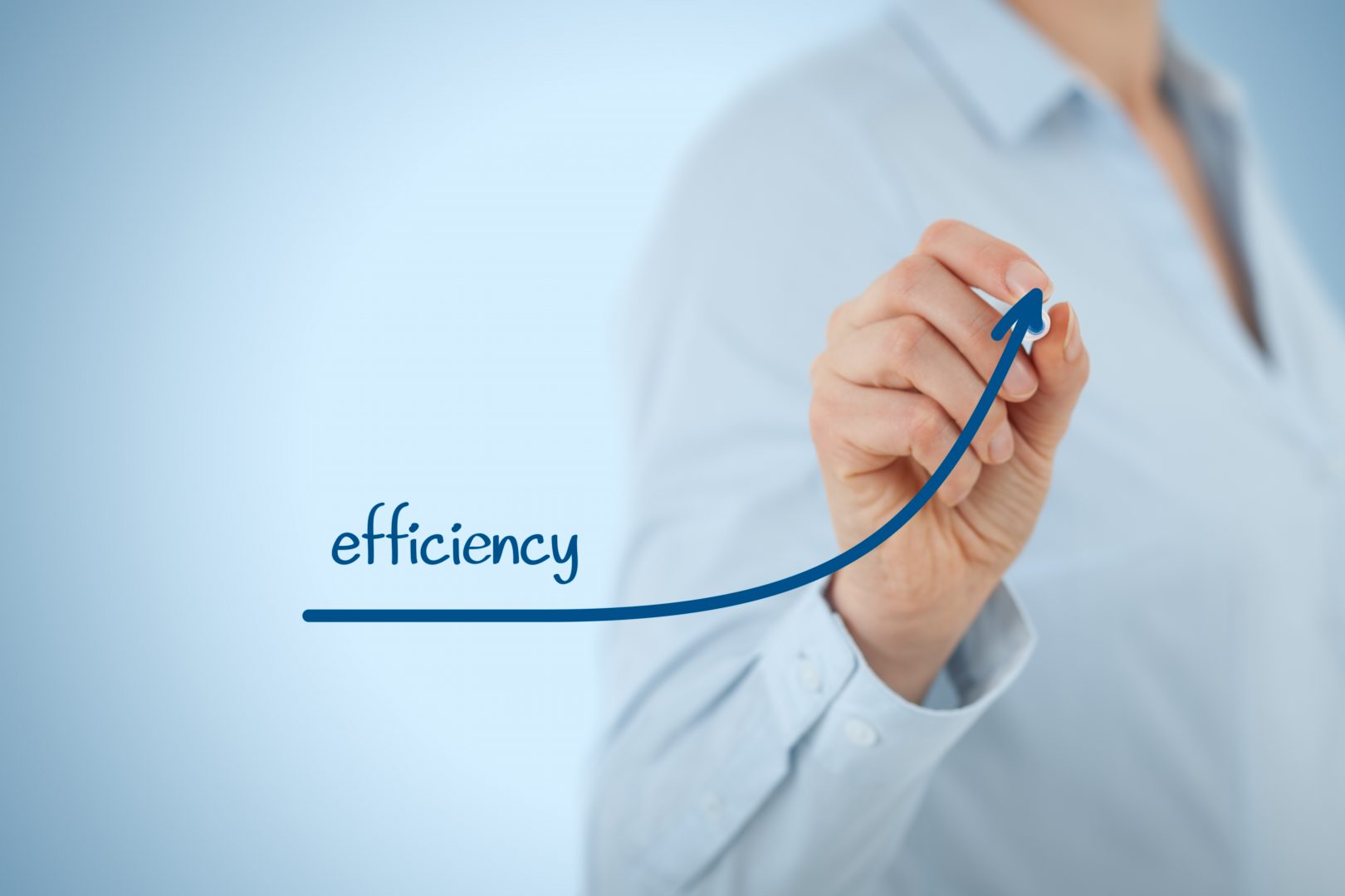 woman drawing the word efficiency with an upward arrow